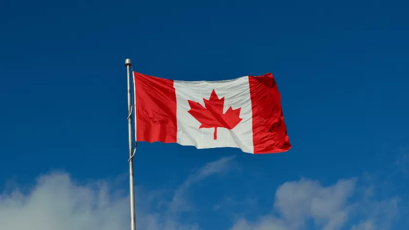 Canada flag with sky in background