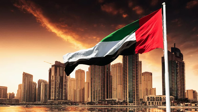 UAE Flag with buildings in the background