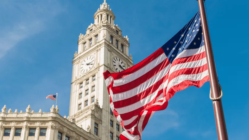 US flag infront of a building