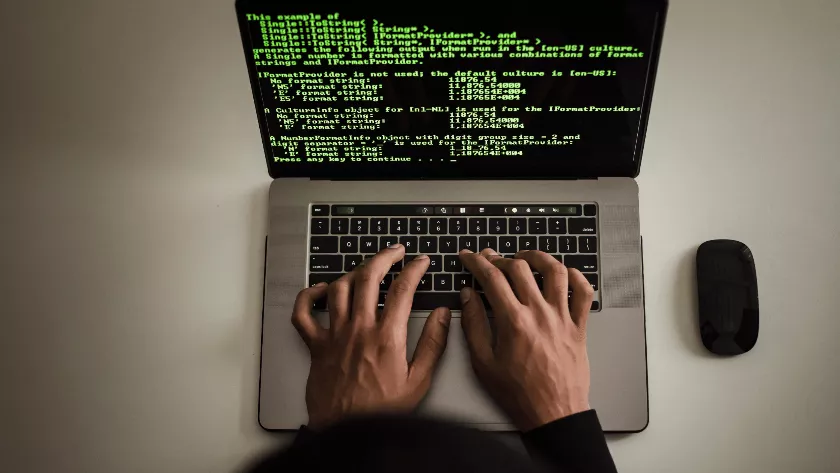 software developer on a laptop