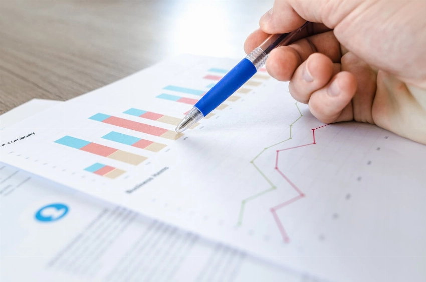 A person going through graphs; Master of Data Analytics in Australia