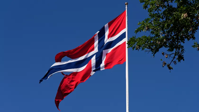 Norwegian flag with sky in the background